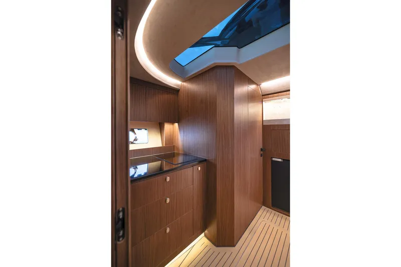 Slide: The Image of Luxurious interior of 2025 Focus 3X yacht with sleek wood finish and modern lighting. - 33