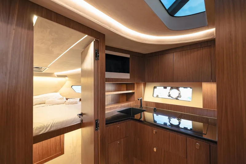 Slide: The Image of Luxurious interior of 2025 Focus 3X yacht with modern kitchen and cozy bedroom. - 35