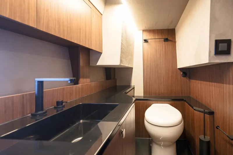 Slide: The Image of Modern bathroom interior in 2025 Focus 3X, featuring sleek wood paneling and black fixtures. - 39