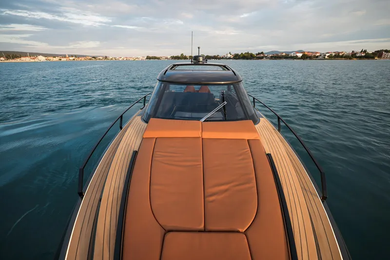 Slide: The Image of Luxurious Focus 3X 2025 yacht cruising on serene waters under a cloudy sky. - 7