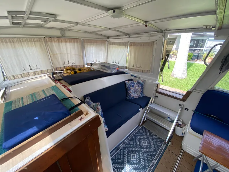 Slide: The Image of Interior of 1986 Albin 34 Family Cruiser with cozy seating and nautical decor. - 18