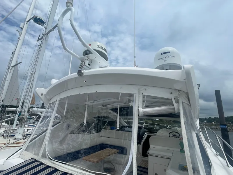 Slide: The Image of 2015 Sunseeker San Remo 48 yacht with clear canopy and advanced navigation equipment. - 16