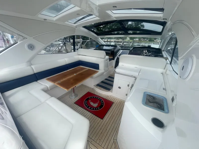 Slide: The Image of Luxurious interior of 2015 Sunseeker San Remo 48 yacht with sleek seating and wooden table. - 18