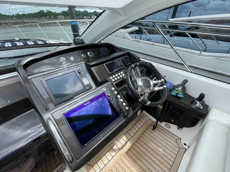 Slide: The Image of Cockpit of 2015 Sunseeker San Remo 48 yacht with modern navigation equipment. - 25