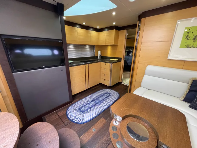 Slide: The Image of Luxurious interior of 2015 Sunseeker San Remo 48 yacht with modern kitchen and seating area. - 27