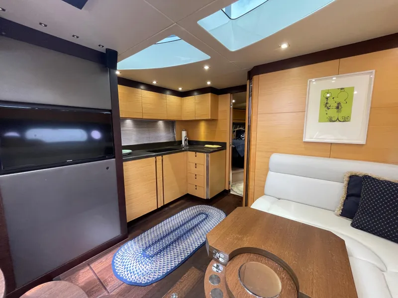 Slide: The Image of Luxurious interior of 2015 Sunseeker San Remo 48 yacht with modern kitchen and seating area. - 30