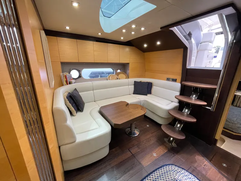 Slide: The Image of Luxurious interior of 2015 Sunseeker San Remo 48 yacht with elegant seating and wooden accents. - 32