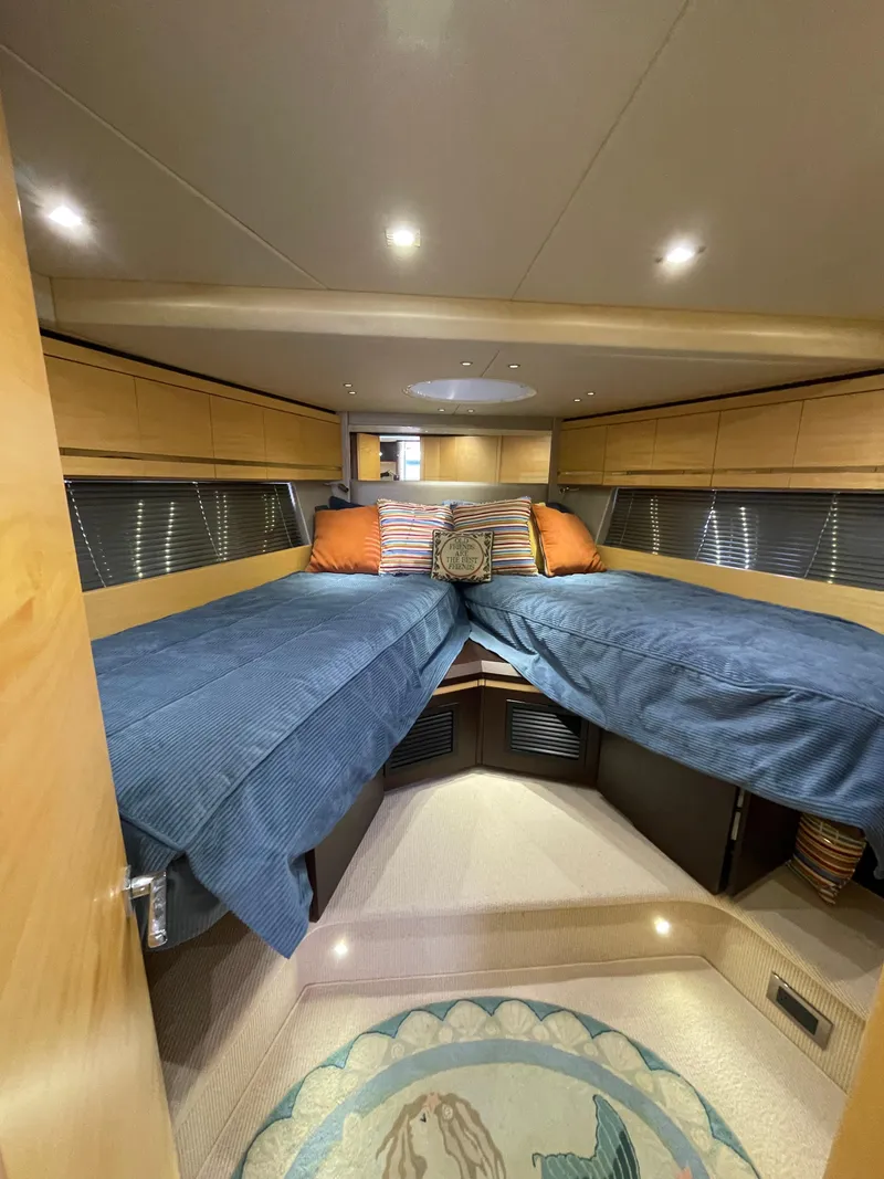 Slide: The Image of Luxurious 2015 Sunseeker San Remo 48 yacht cabin with twin beds and elegant decor. - 39
