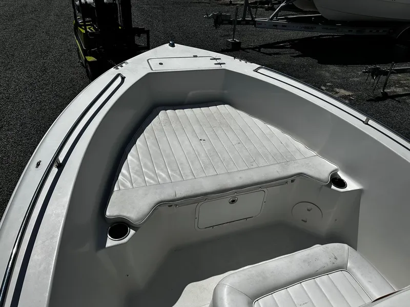 Slide: The Image of 2013 Sea Hunt Triton 202 Center Console boat interior with cushioned seating. - 10