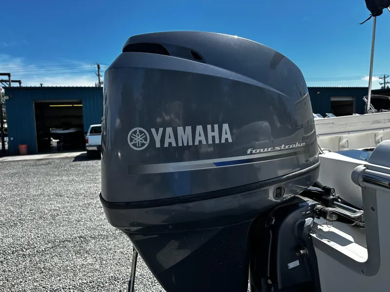 Slide: The Image of Yamaha four-stroke engine on 2013 Sea Hunt Triton 202 Center Console boat. - 12