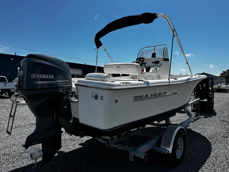 Slide: The Image of 2013 Sea Hunt Triton 202 Center Console boat with Yamaha engine on trailer. - 2