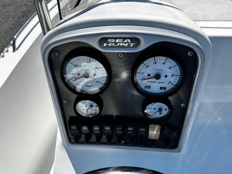 Slide: The Image of 2013 Sea Hunt Triton 202 Center Console dashboard with Yamaha gauges and controls. - 5