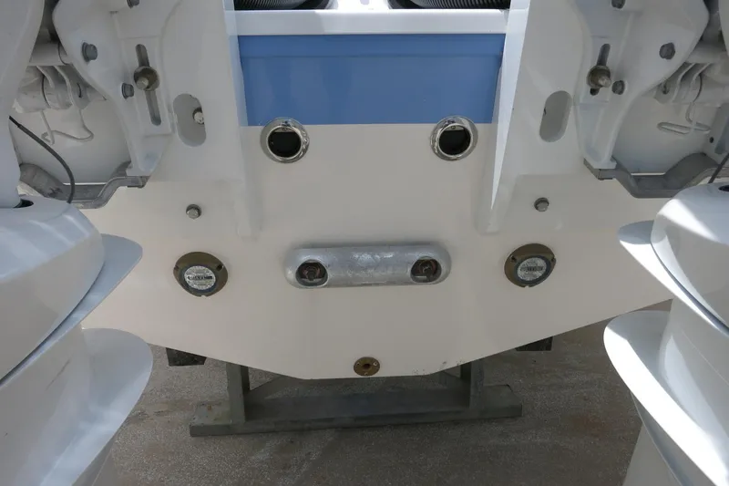 Slide: The Image of 2025 Robalo R317 Dual Console boat transom with engine mounts and fittings. - 13