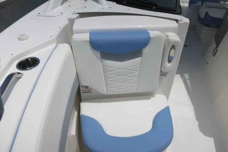 Slide: The Image of 2025 Robalo R317 Dual Console boat seat with blue and white upholstery. - 17