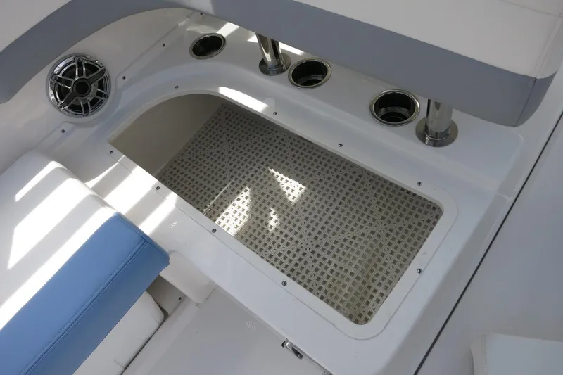 Slide: The Image of 2025 Robalo R317 Dual Console boat interior with seating and cup holders. - 31
