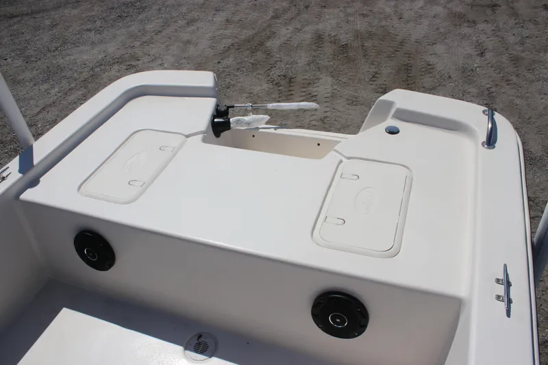 Slide: The Image of 2025 Carolina Skiff E18 JVX CC boat deck with storage compartments and speakers. - 13