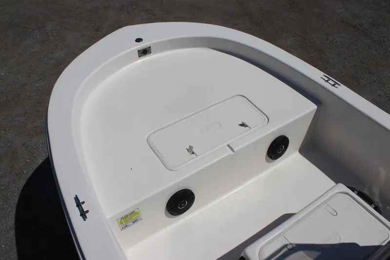 Slide: The Image of 2025 Carolina Skiff E18 JVX CC boat deck with storage compartments and speakers. - 6