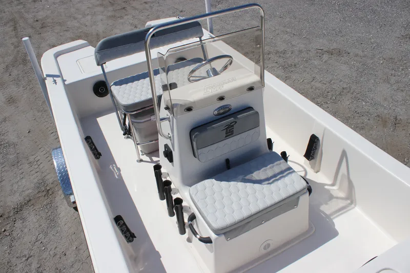 Slide: The Image of 2025 Carolina Skiff E18 JVX CC boat interior with seating and steering console. - 7