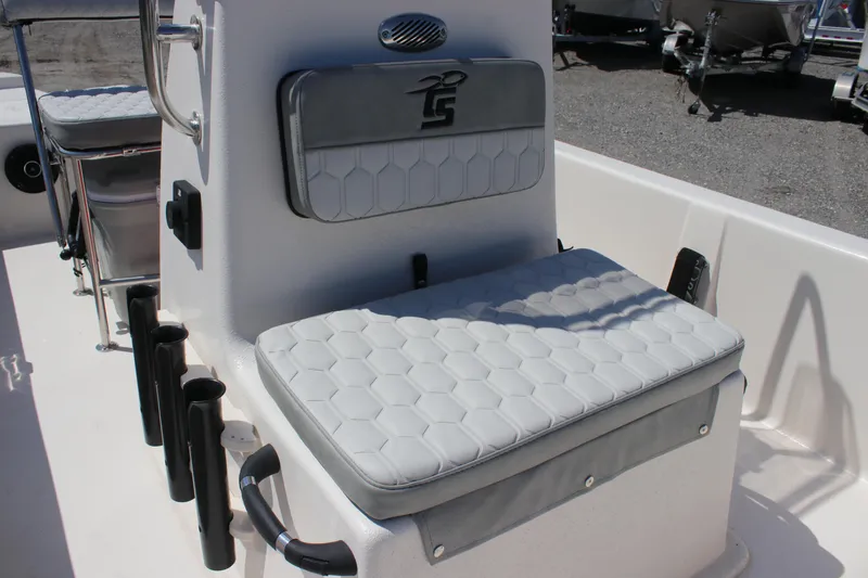 Slide: The Image of 2025 Carolina Skiff E18 JVX CC boat seat with rod holders and cushioned backrest. - 8