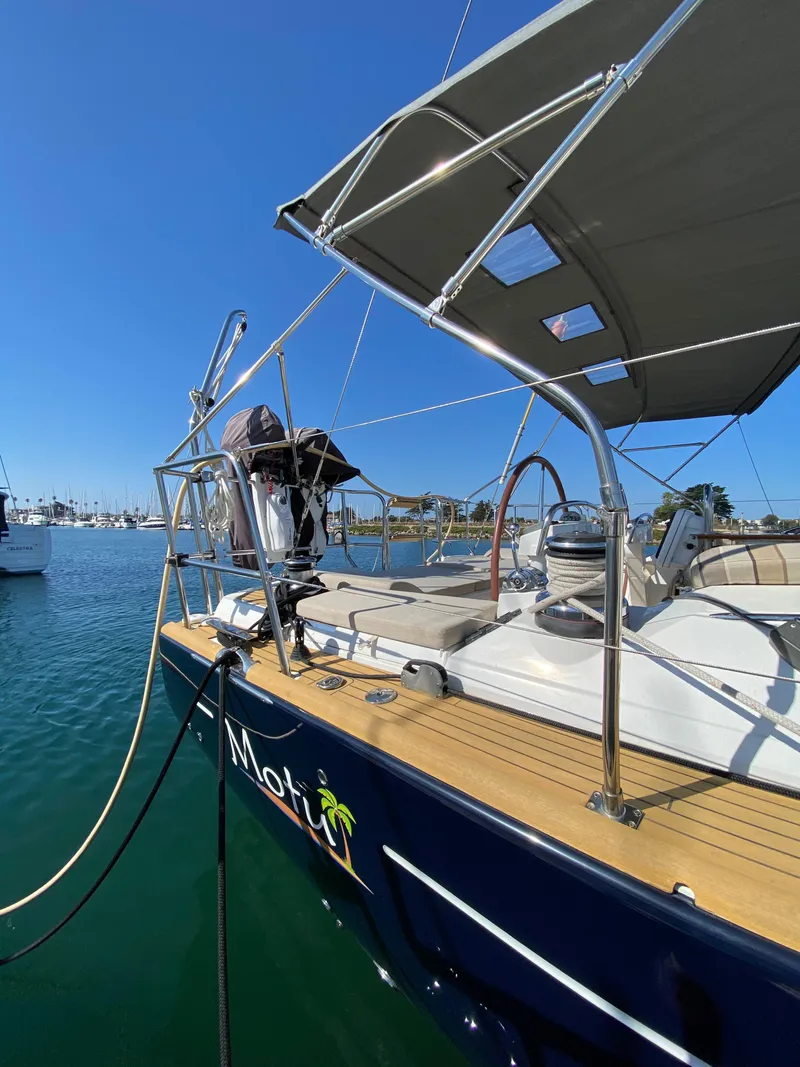 Slide: The Image of 2013 Jeanneau 57 yacht docked in sunny marina. - 12