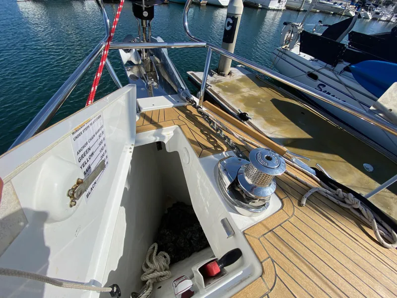 Slide: The Image of Jeanneau 57 sailboat deck with open anchor locker, 2013 model, docked at marina. - 22