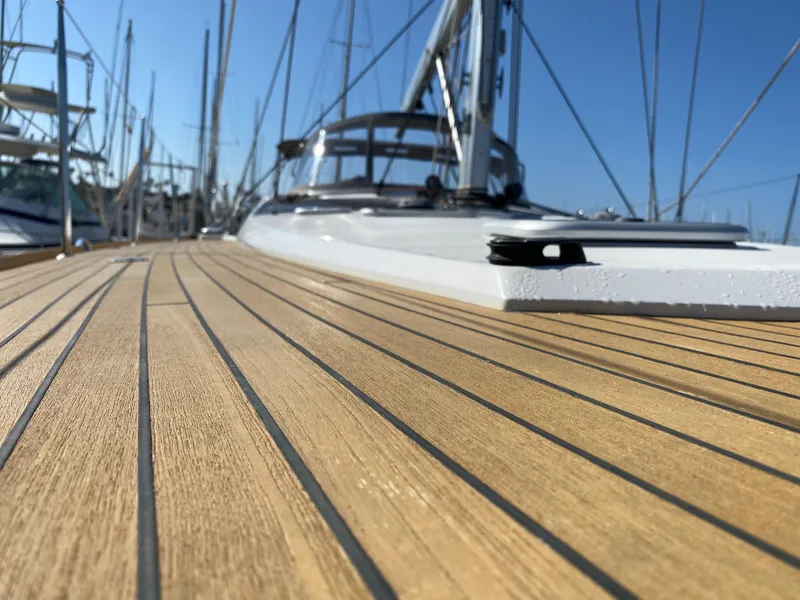Slide: The Image of Close-up of 2013 Jeanneau 57 yacht deck with sleek wooden finish. - 28