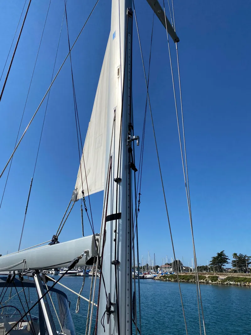 Slide: The Image of Jeanneau 57 sailboat mast and rigging against clear blue sky, 2013 model. - 29