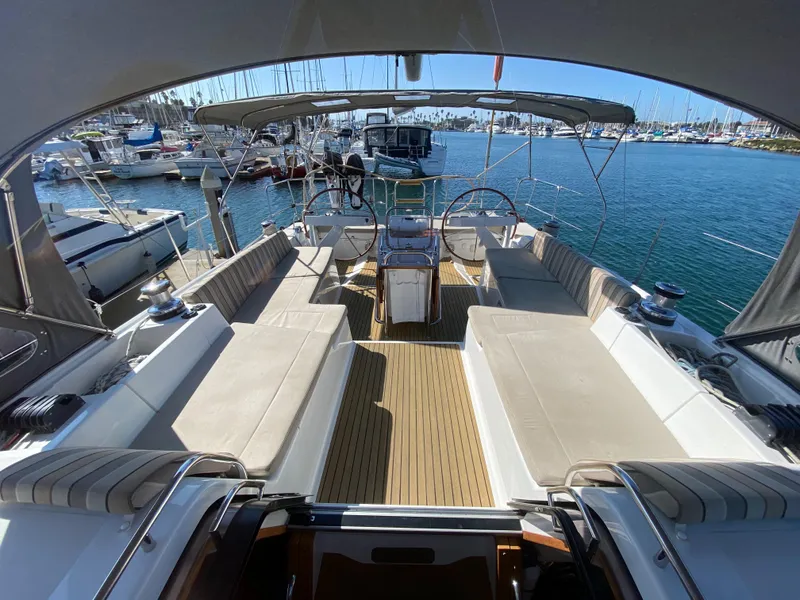 Slide: The Image of Spacious deck of 2013 Jeanneau 57 yacht in marina setting. - 32