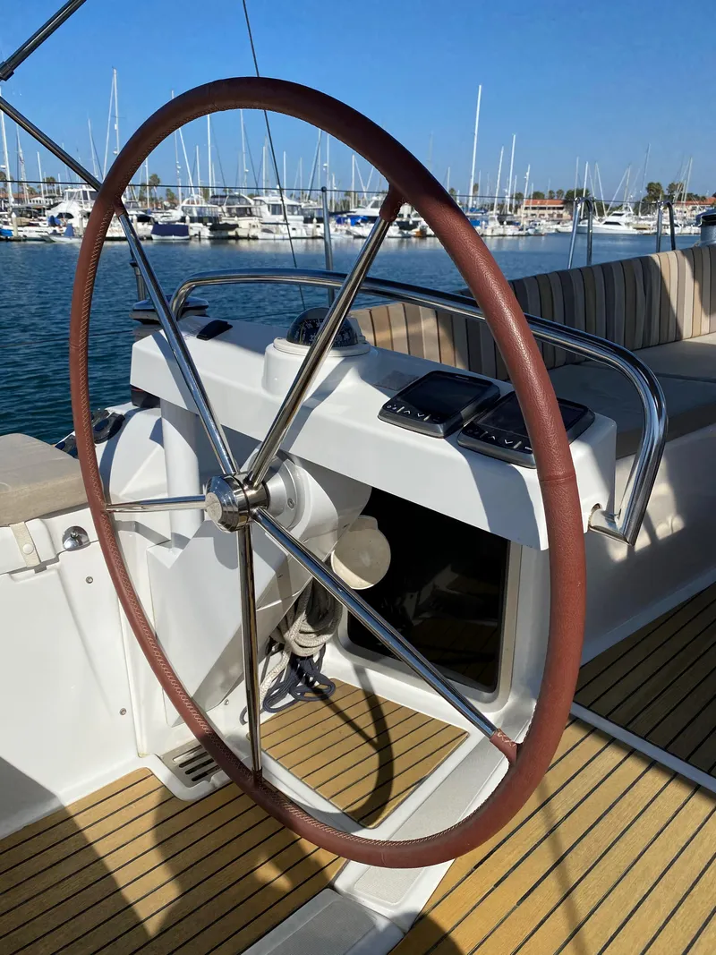 Slide: The Image of Steering wheel of 2013 Jeanneau 57 yacht, docked at marina. - 35