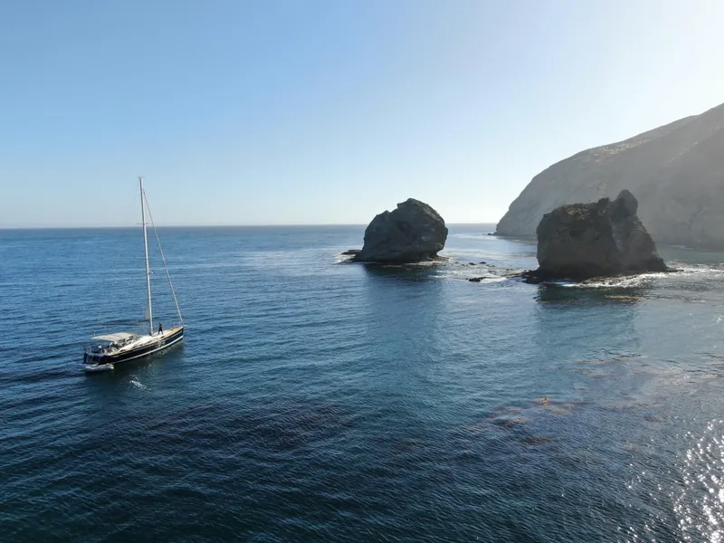 Slide: The Image of Jeanneau 57 sailboat cruising near rocky coastline, 2013 model. - 6
