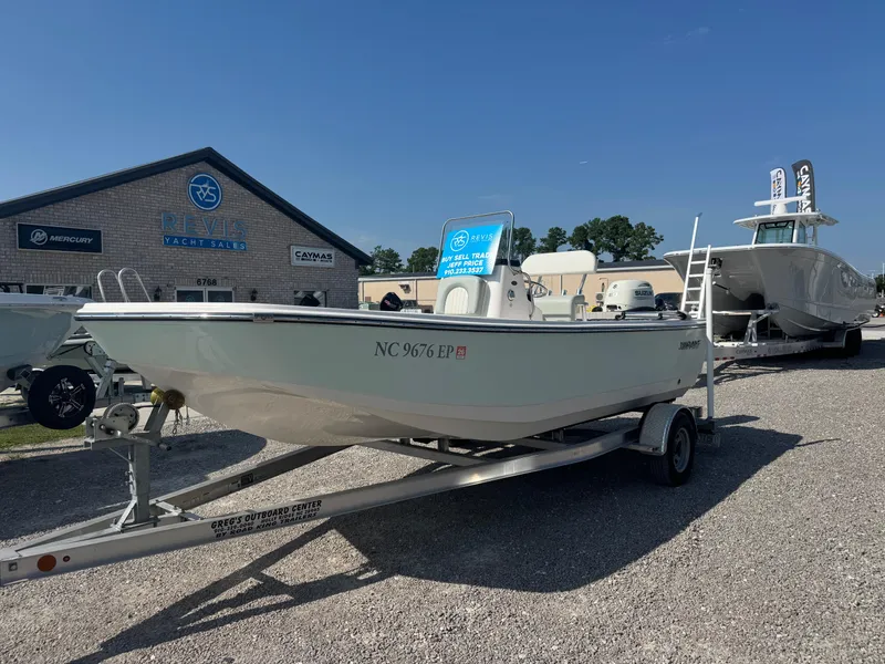 The Image of 2020 Sundance 20DX boat on trailer at yacht sales dealership. - 0