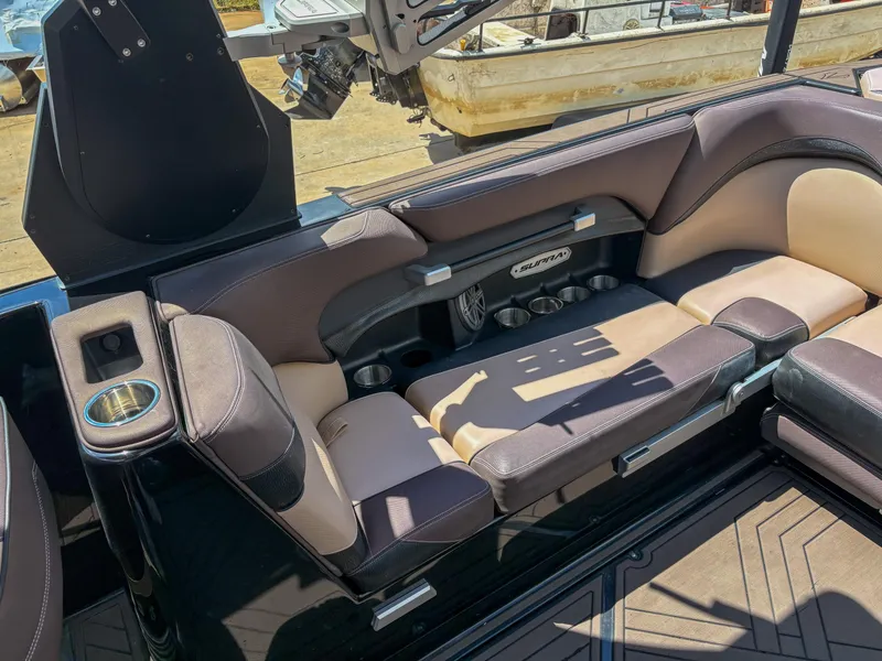 Slide: The Image of 2018 Supra SE 450 boat interior with luxurious seating and cup holders. - 11