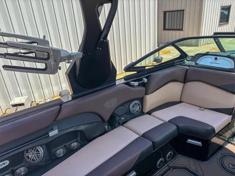 Slide: The Image of 2018 Supra SE 450 boat interior with sleek seating and modern design elements. - 6