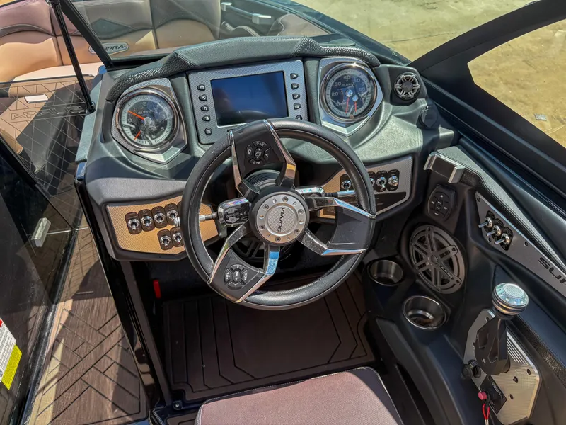Slide: The Image of 2018 Supra SE 450 boat dashboard with steering wheel and control panel. - 8