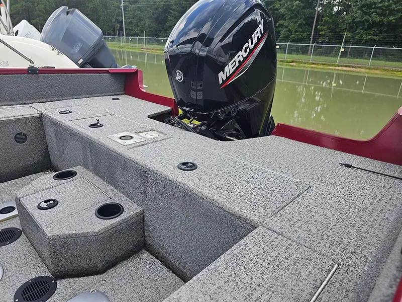 Slide: The Image of 2022 Tracker Pro Guide V-175 WT boat with Mercury engine on a calm lake. - 5