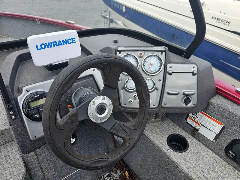 Slide: The Image of 2022 Tracker Pro Guide V-175 WT dashboard with Lowrance device and steering wheel. - 6