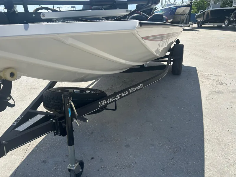 Slide: The Image of 2021 Ranger RT178C boat on trailer, parked outdoors in sunlight. - 6