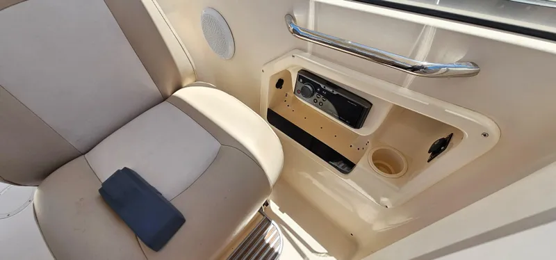 Slide: The Image of Interior of 2011 Grady-White Freedom 275 boat with seat and audio system. - 11
