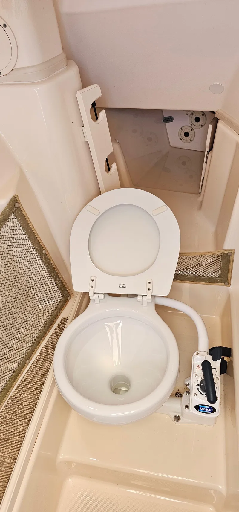 Slide: The Image of Boat toilet in 2011 Grady-White Freedom 275, featuring compact marine design. - 12