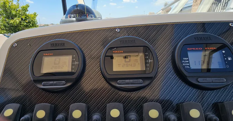 Slide: The Image of Dashboard of a 2011 Grady-White Freedom 275 boat with Yamaha gauges. - 14