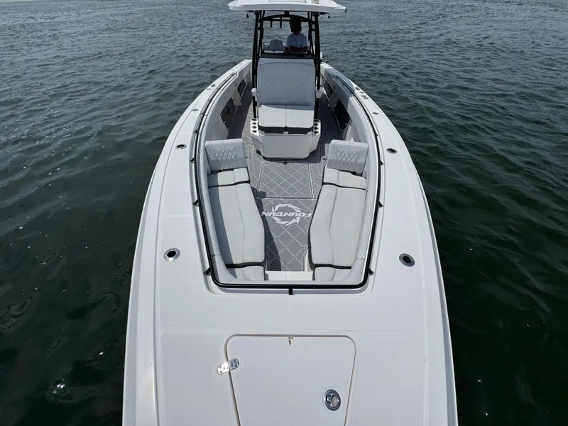 Slide: The Image of 2021 Fountain 38TE boat with sleek design and spacious seating on open water. - 23