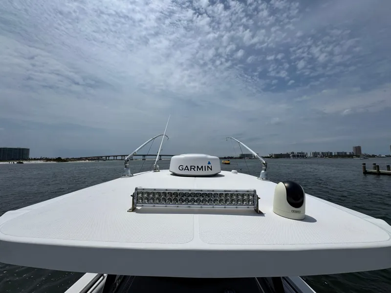 Slide: The Image of 2021 Fountain 38TE boat with Garmin equipment on open water under cloudy sky. - 27