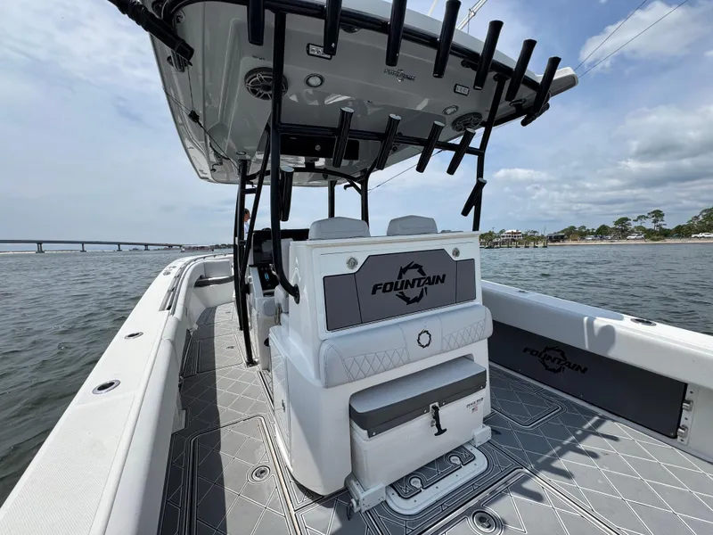 Slide: The Image of 2021 Fountain 38TE boat on water, featuring sleek design and spacious deck. - 36