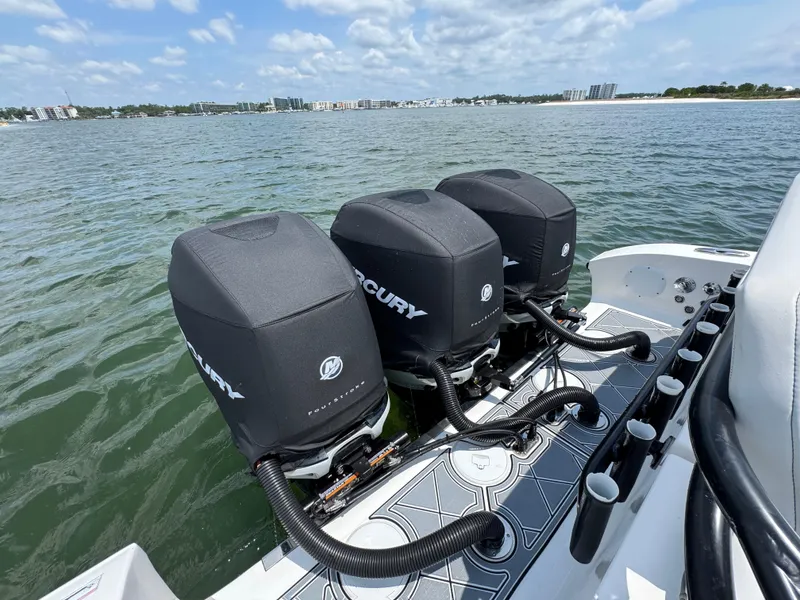 Slide: The Image of 2021 Fountain 38TE boat with triple Mercury outboard engines on water. - 42