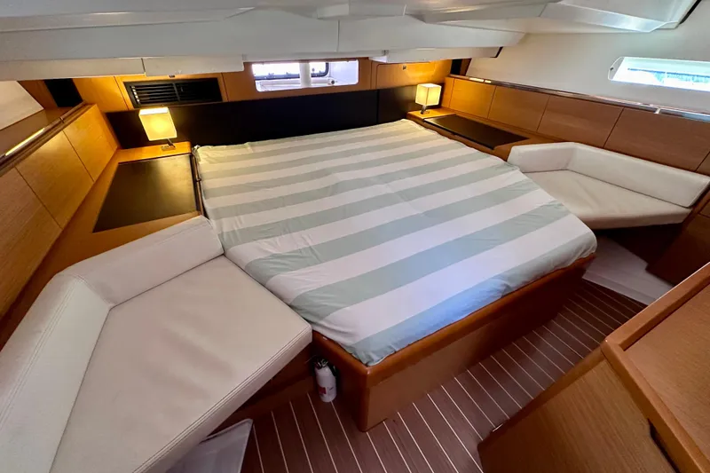 Slide: The Image of Luxurious cabin interior of 2014 Jeanneau Sun Odyssey 44 DS yacht with cozy bed and seating. - 11