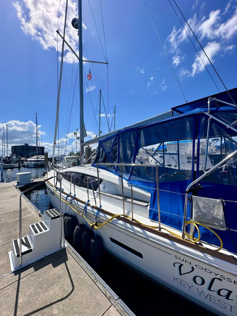 Slide: The Image of Jeanneau Sun Odyssey 44 DS sailboat docked under a clear blue sky, 2014 model. - 3