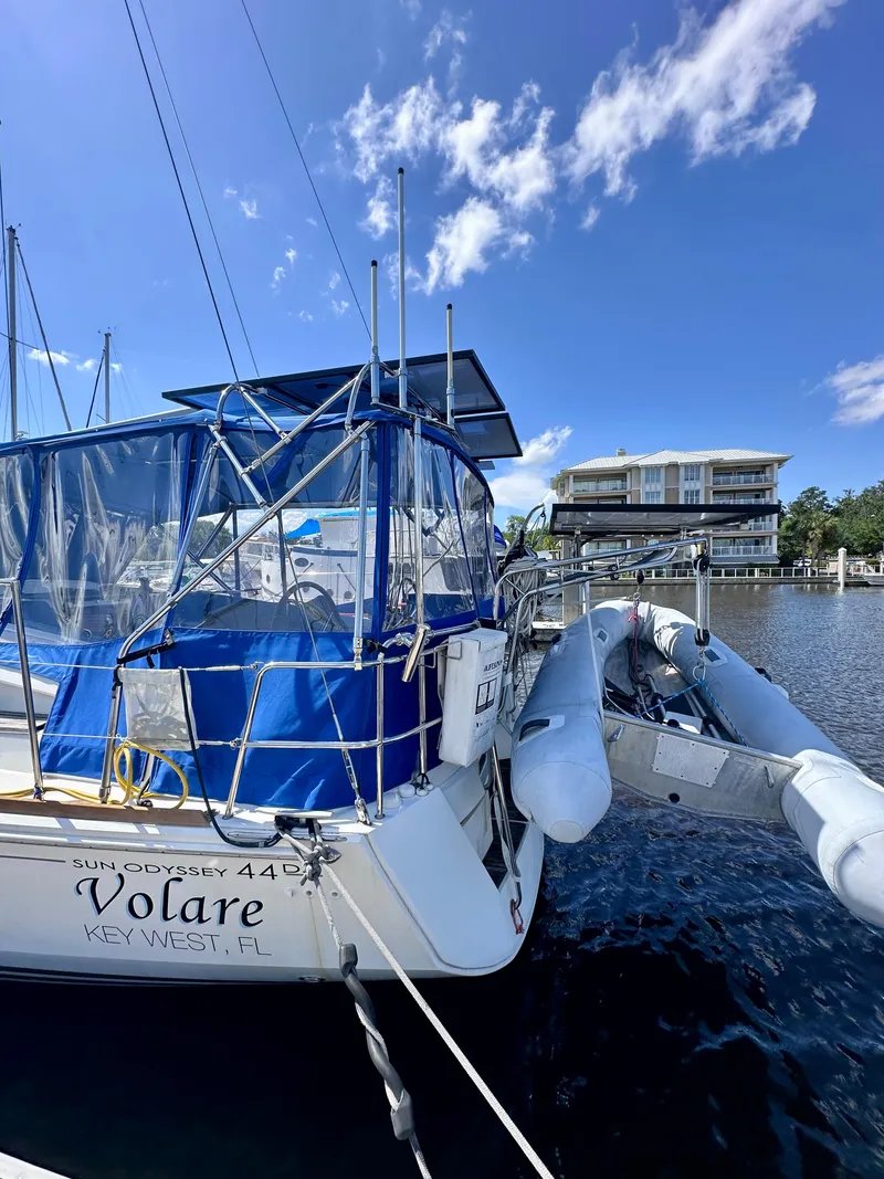 Slide: The Image of 2014 Jeanneau Sun Odyssey 44 DS sailboat docked in Key West marina under clear blue sky. - 6