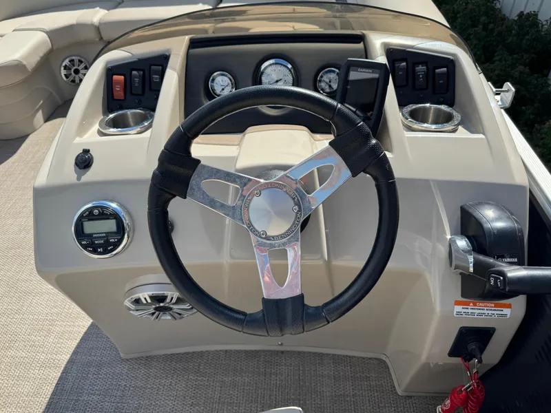 Slide: The Image of 2019 Bennington SX 21 SSRCX boat dashboard with steering wheel and controls. - 10