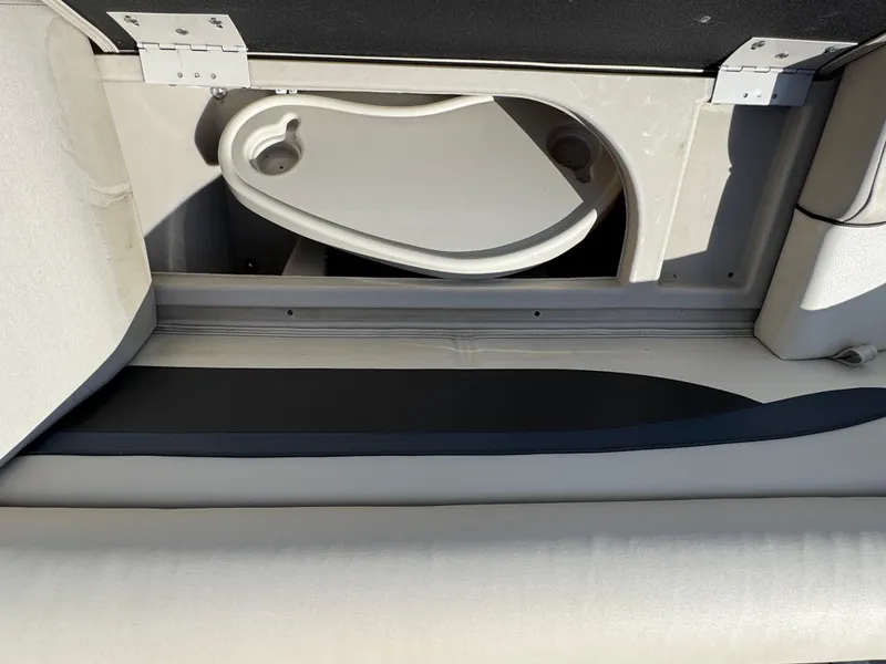 Slide: The Image of Storage compartment in a 2019 Bennington SX 21 SSRCX pontoon boat. - 18