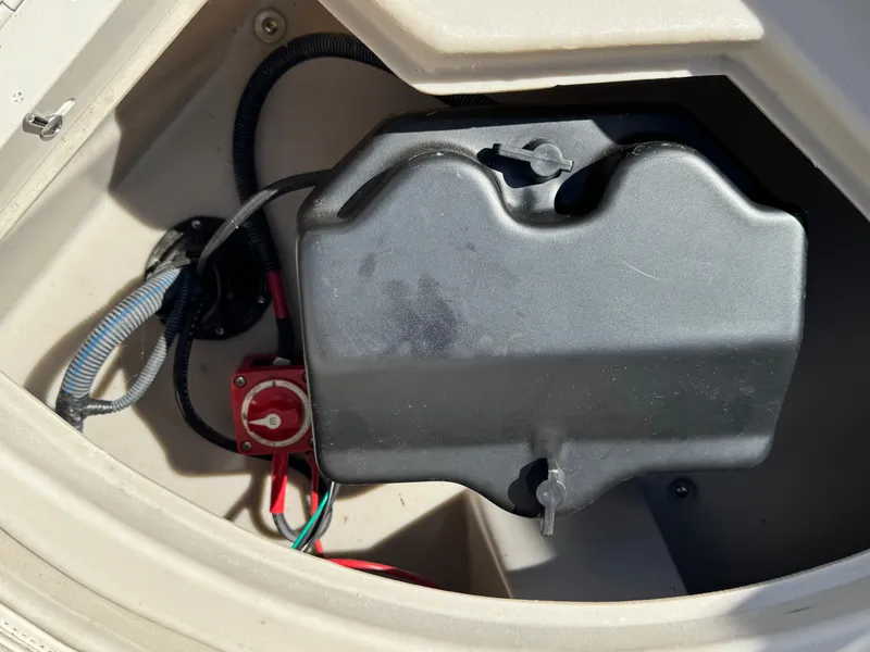 Slide: The Image of Battery compartment of 2019 Bennington SX 21 SSRCX boat, featuring wiring and switch. - 25